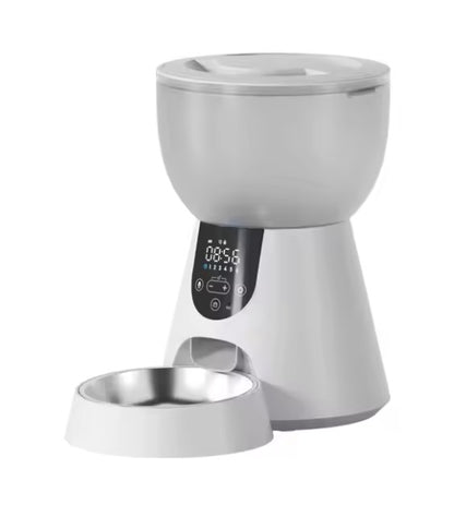 White pet feeder with digital display on a white background